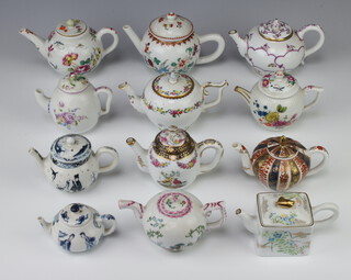 Twelve Kyoto Victoria and Albert Museum miniature model teapots 