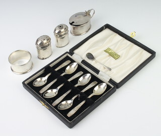A set of 6 silver coffee spoons Sheffield 1938, a napkin ring, 2 peppers and a mustard, gross weight 134 grams 