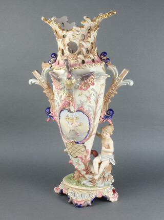 A large and impressive Edwardian pierced German Rococo style pottery vase in the form of a twin handled cornucopia decorated a bird and cherub, raised on a shaped base 77cm h 