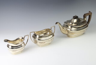 A silver 3 piece tea set of rounded rectangular form London 1912, gross weight 1140 grams 