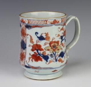 A 19th Century Japanese Imari mug raised on a circular spreading foot 16cm 