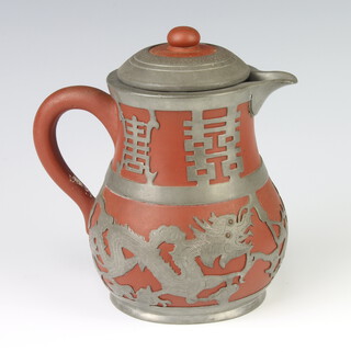 A tanware jug with metal mounts and lid 15cm 