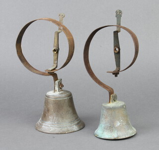 A 19th Century brass servants bell 7cm x 8cm, 1 other 8cm x 10cm 
