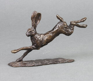 In the manner of Richard Cooper & Co., an unmarked bronze figure of a running hare 7cm x 15cm x 8cm 