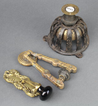 A Browns patent doorbell 13cm x 12cm, a Victorian brass Arts & Crafts door knocker 14cm x 7cm and a gilt metal and porcelain servant bell 10cm x 4cm 
