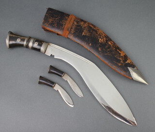 A Kukri with horn grip and 2 skinning knives, complete with scabbard 