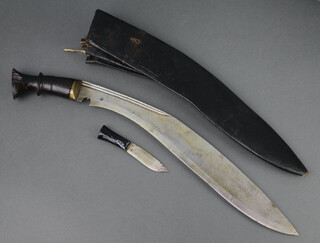 A Kukri with wooden grip, 1 skinning knife and leather scabbard 