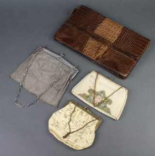 A 1930's crocodile handbag, a chainmail evening bag, a beadwork bag and a gilt mounted and fabric bag 
