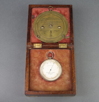 Negretti and Zambra, an aneroid barometer with silvered dial marked Negretti and Zambra London 15817 contained in a silver plated case 7cm diam together with a circular slide rule forecaster marked patent 6276 1915, contained in a brass banded mahogany case 