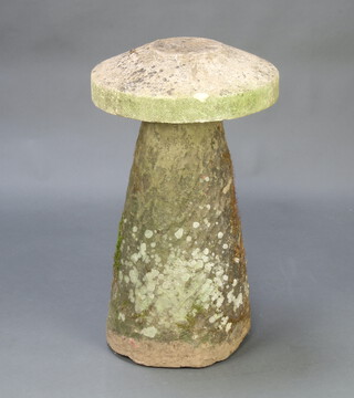 A stone staddle stone with associated top, the base 68cm h the top 8cm x 47cm diam. 