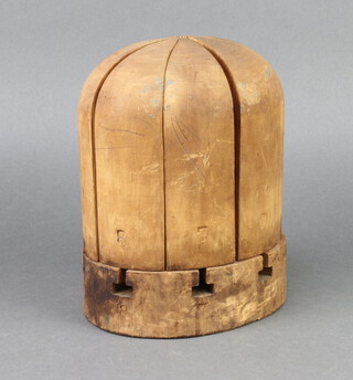 Rossiter, a 1920's 8 section domed adjustable hat block marked 128, the base impressed Rossiter 1030 23cm h x 18cm w x 15cm