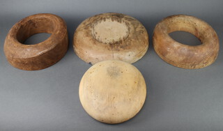 Four 19th Century squat and oval shaped unmarked hat blocks 6cm x 26cm x 21cm, 8cm x 36cm diam., 9cm x 29cm x 26cm, 8cm x 29cm x 27cm (all have pin marks) 