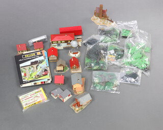 A quantity of Faller plastic buildings including castle, windmill, etc, model trees and catalogues 