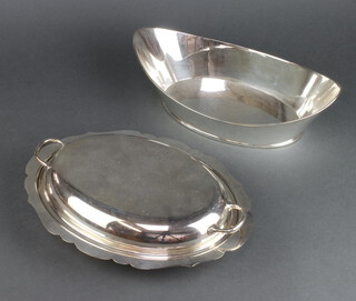 A silver plated boat shaped bread basket together with a ditto entree set 