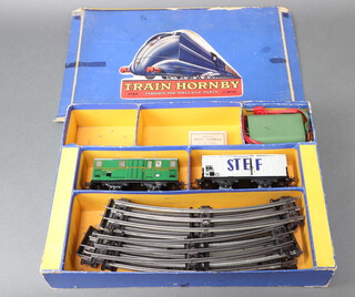 A French Hornby O gauge train set including no.0 transformer, 2 items of rolling stock and a quantity of rails (locomotive and tender missing, lamps missing),  