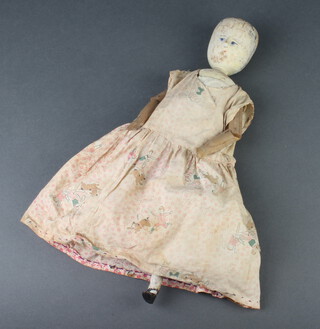 An 18th/19th Century grey painted wooden peg doll with articulated limbs 37cm 