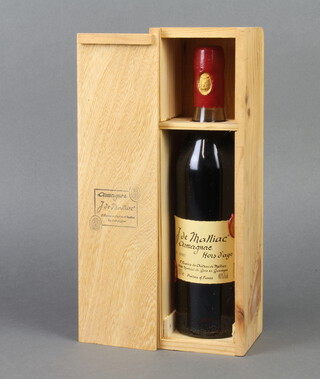 A 70cl bottle of J. de Malliac Armagnac hors d'age no, 02391, 40% vol., contained in a wooden presentation box  