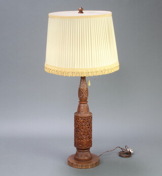 A carved hardwood Eastern table lamp of club form 81cm x 24cm 