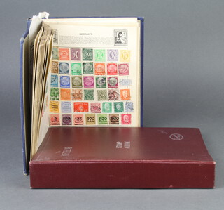 The Meteor stamp album containing a collection of world stamps - GB, Victoria to Elizabeth II, Hong Kong, Australia, Aiden together with a Quickchange blue stamp album of various world stamps 