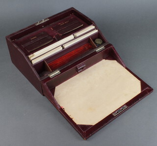 A Victorian red leather covered writing slope/stationery box, together with 2 red leather covered books marked Mellows and Where Is It?, fitted 1 inkwell 14cm h x 30cm w x 22cm d 