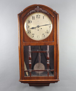 Gustav Becker, a chiming wall clock, the 25cm silvered dial with Arabic numerals contained in a shaped mahogany case 81cm h x 41cm w x 16cm d