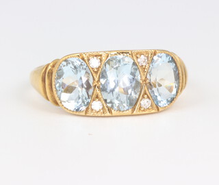 A yellow metal aquamarine and brilliant cut diamond ring the aquamarine approx. 1.9ct, the diamonds approx. 0.05ct ring, size L 1/2, 3.5 grams  