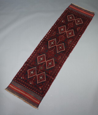 A red and blue ground Meshwani runner with 40 diamonds to the centre 235cm x 62cm 