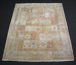 A white ground Persian garden pattern rug, the centre formed of 36 panels within a multi row border 298cm x 240cm 