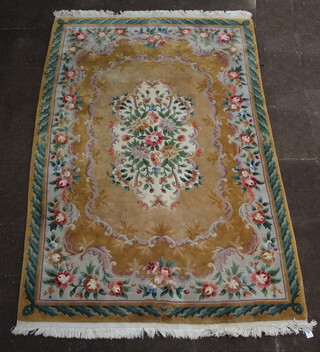 A yellow ground and floral patterned Chinese rug with central medallion 283cm x 186cm 