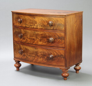 A 19th Century mahogany bow front chest of 3 drawers raised on turned supports 86cm h x 92cm w x 49cm d 