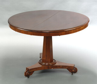 A Victorian circular mahogany snap top breakfast table raised on a chamfered column and tripod base with scroll feet, complete with bolts 68cm h x 105cm diam. 