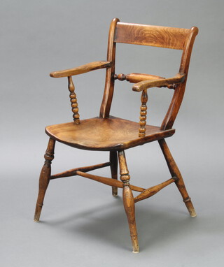 A 19th Century elm bar back Windsor carver chair with shaped mid rail, raised on turned stretchers 85cm h x 44cm w x 41cm d (seat 30cm x 31cm) 
