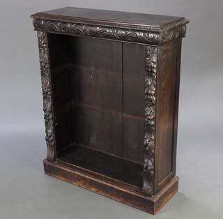 A Victorian carved oak bookcase 111cm h x 92cm w x 33cm d 
