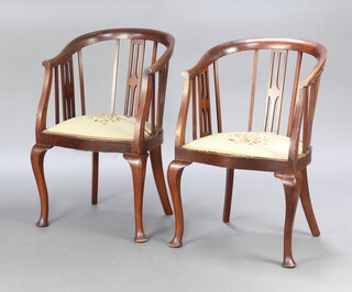 A pair of Edwardian stick and tub back armchairs with Berlin woolwork seats, raised on cabriole supports 85cm h x 53cm w x 42cm d (seat 28cm x 26cm) 