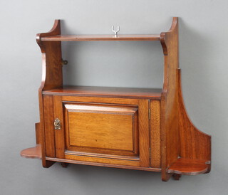 An Edwardian mahogany hanging cabinet fitted a shelf above cupboard enclosed by a panelled door 56cm h x 70cm w x 16cm d 