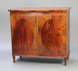 S & H Jewell, 29,30 and 31 Little Street, Holburn, a 19th Century inlaid mahogany bow front cabinet enclosed by panelled doors, raised on turned supports 101cm h x 107cm w x 55cm d 