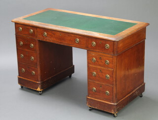 A Victorian bleached mahogany desk with green writing surface above 1 long and 8 short drawers, 74cm h x 122cm w x 61cm d 