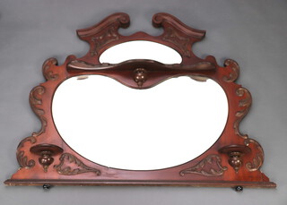 An Edwardian shaped plate over mantel mirror, fitted shelves, contained in a shaped mahogany frame 98cm x 120 x 4 