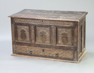 A 17th/18th Century carved oak mule chest with hinged lid, the base fitted a drawer 66cm h x 113cm w x 56cm d 