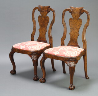 A pair of Queen Anne style figured walnut slat back chairs with shaped drop in seats, raised on cabriole, ball and claw supports 96cm h x 54cm w x 46cm d (seat 30cm x 31cm) 