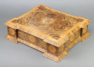 A walnut inlaid oyster veneered trinket box with hinged lid, raised on bracket feet 11cm x 43cm x 38cm  