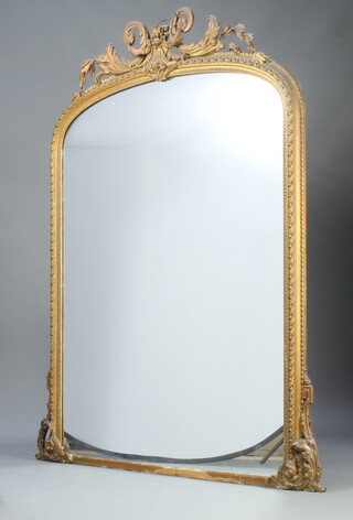 A Victorian arched plate over mantel mirror contained in a decorative gilt frame surmounted by swags 180cm h x 153cm w x 6cm d 