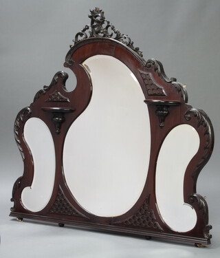 An Edwardian triple plate over mantel mirror fitted 3 shaped bevelled plate mirrors contained in a carved mahogany frame with 2 shelves 141cm h x 152cm w x 4cm d 