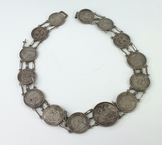 A coin belt made up of an 1888 crown, 7 South African 2 shilling coins and 6 South African 2 1/2 shilling coins, gross weight 222gms 