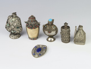 A white metal stone mounted scent bottle and 4 others