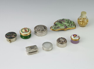 A white metal pill box, 3 others and minor trinket boxes