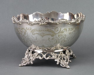 A Victorian silver plated bowl with scroll decoration raised on a Rococo base 16cm 