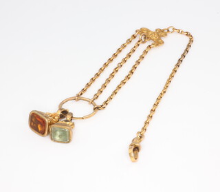 A gilt metal chain with 2 small hardstone seals 