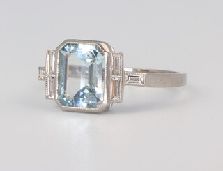 A white metal stamped Plat. aquamarine and diamond ring, the centre stone 1.7ct, the baguette cut diamonds 0.20ct, size N, 4.3ms 