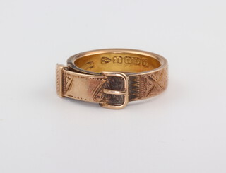 A 19th Century yellow metal stamped 15ct buckle ring with in memoriam recess, size M, 4gms 